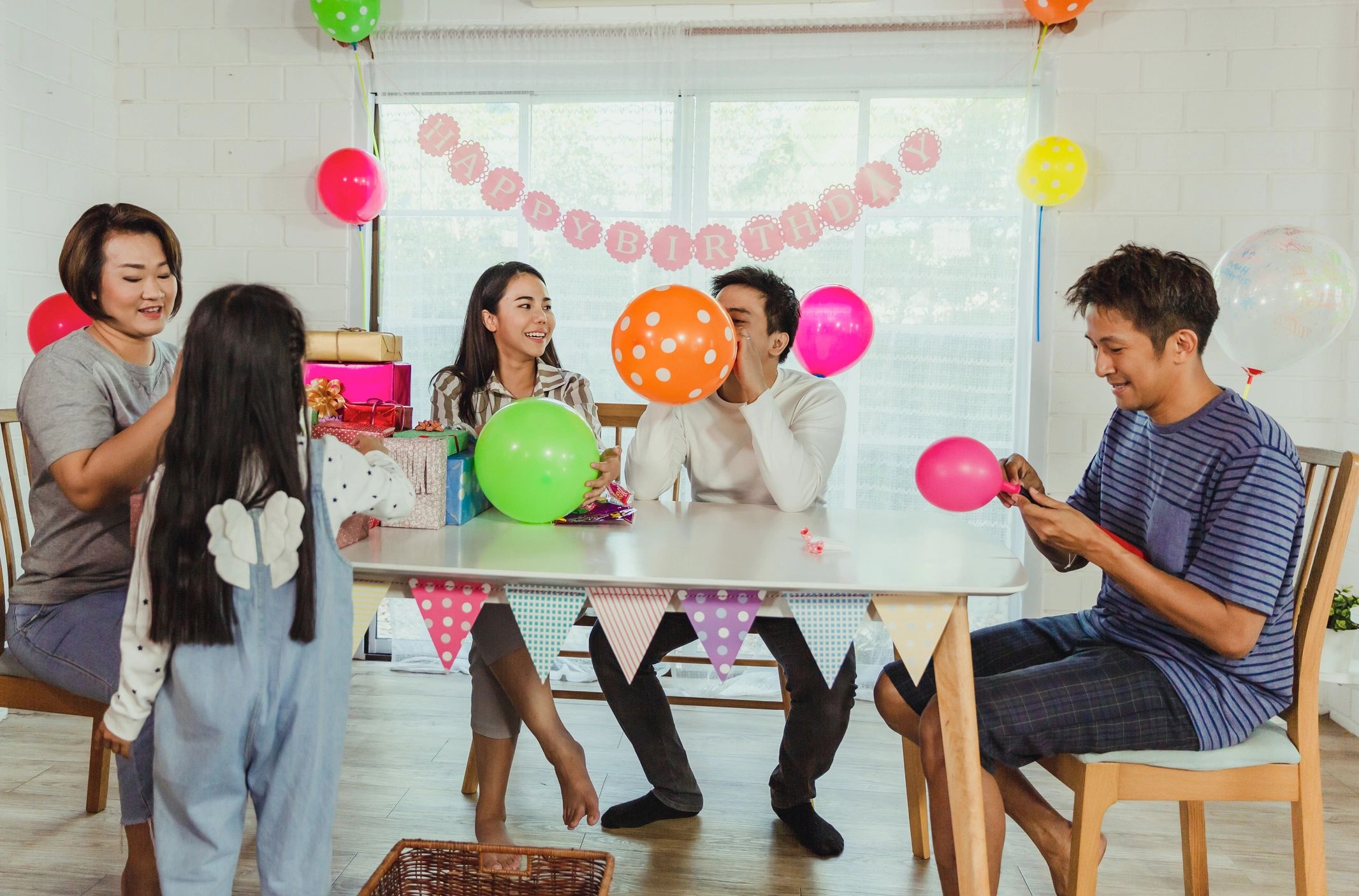 Family decorating for a birthday party