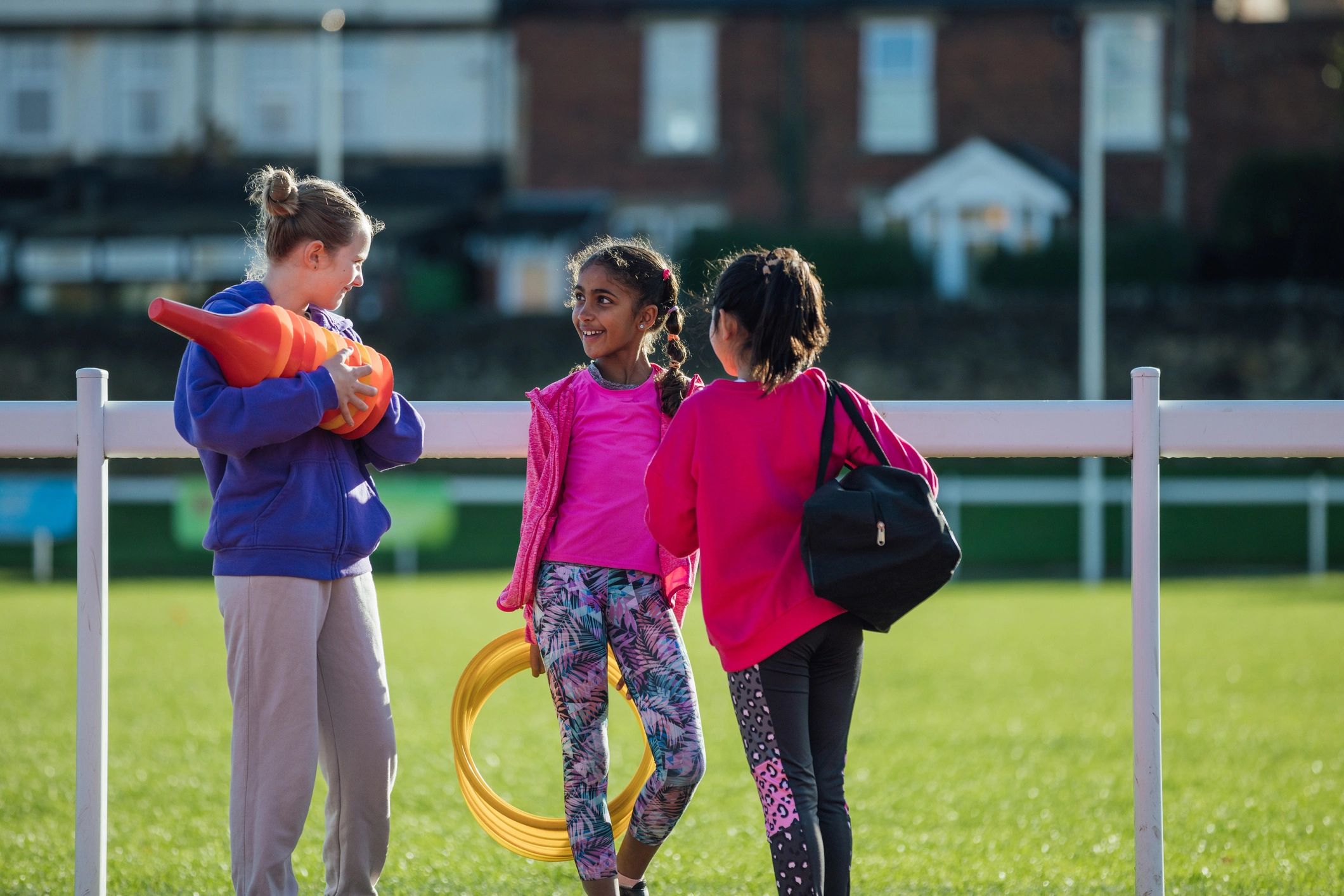 Children preparing for an organized outdoor school sports event