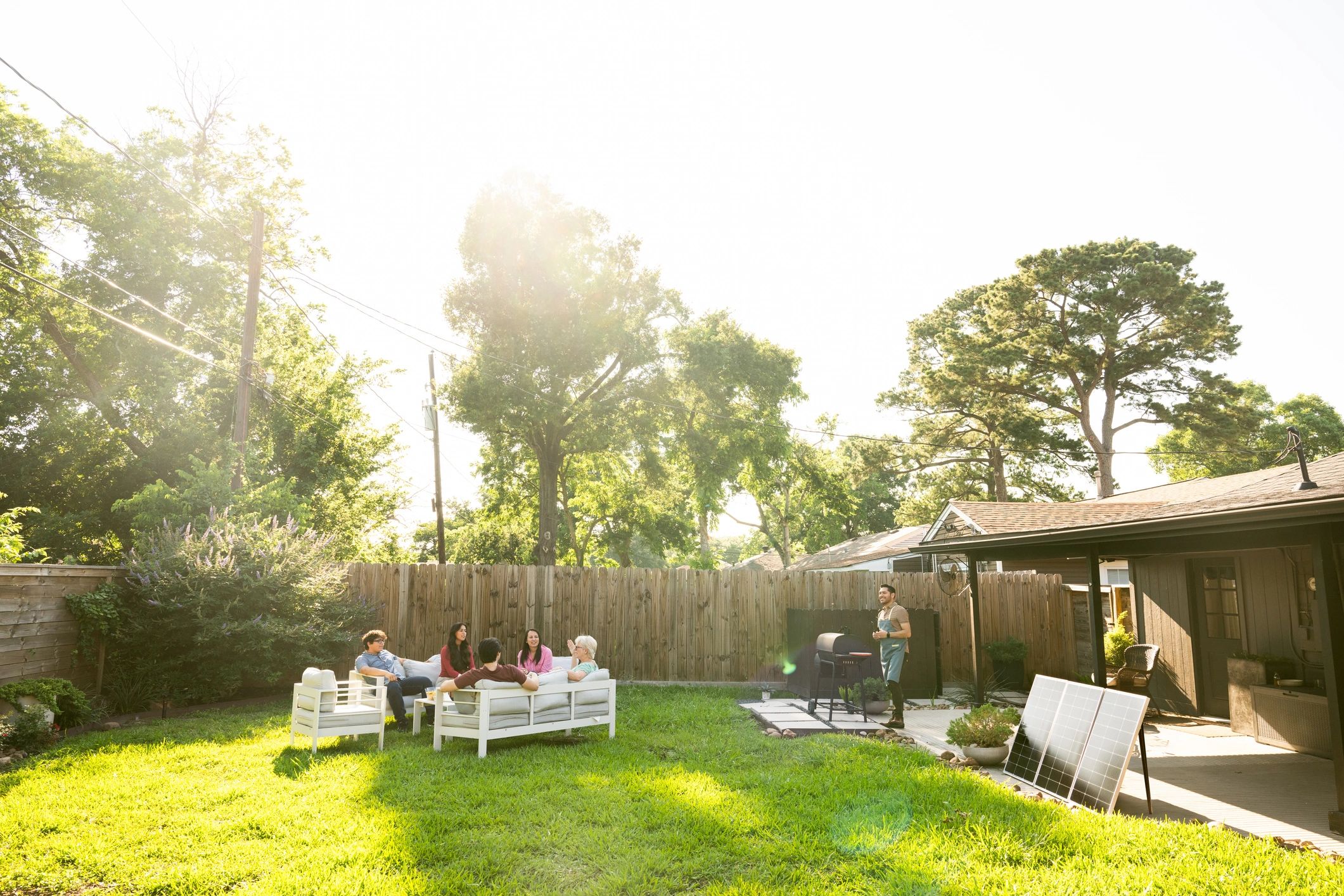Outdoor gathering with seating and event setup