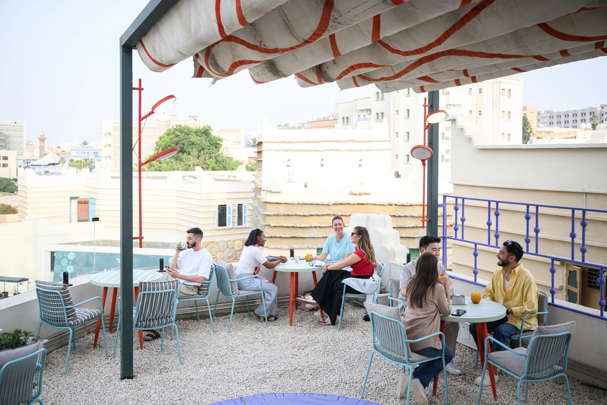 Party seating and gathering setup under a canopy