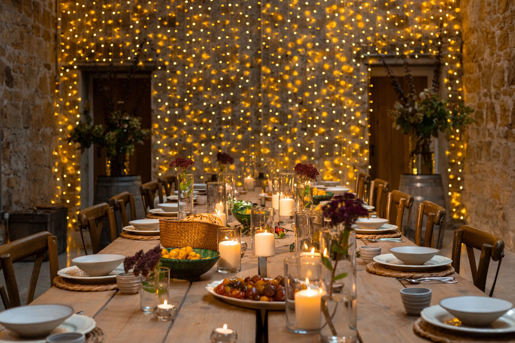 Wedding reception table setup with décor and lighting