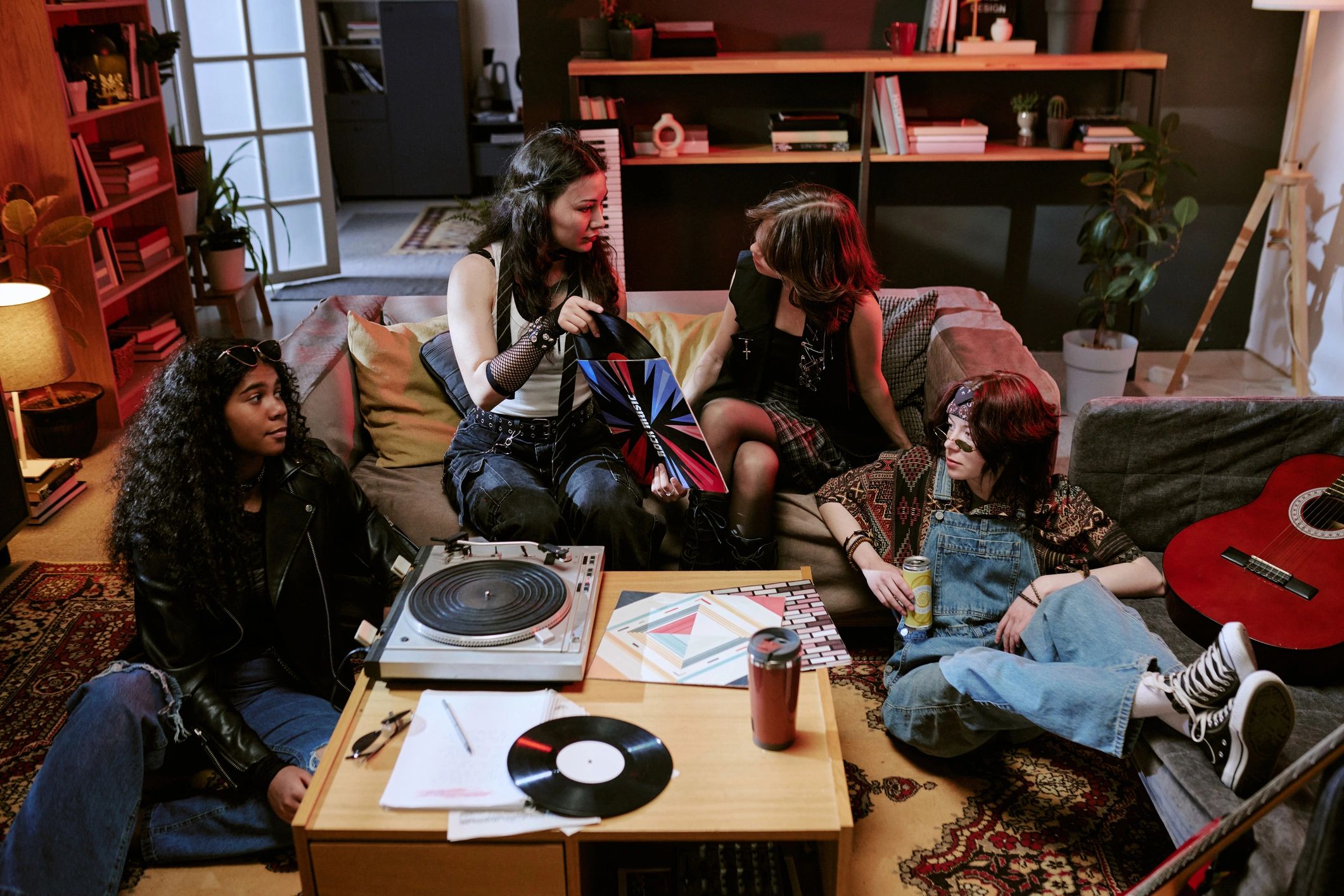 Guests gathered around music equipment during a social event
