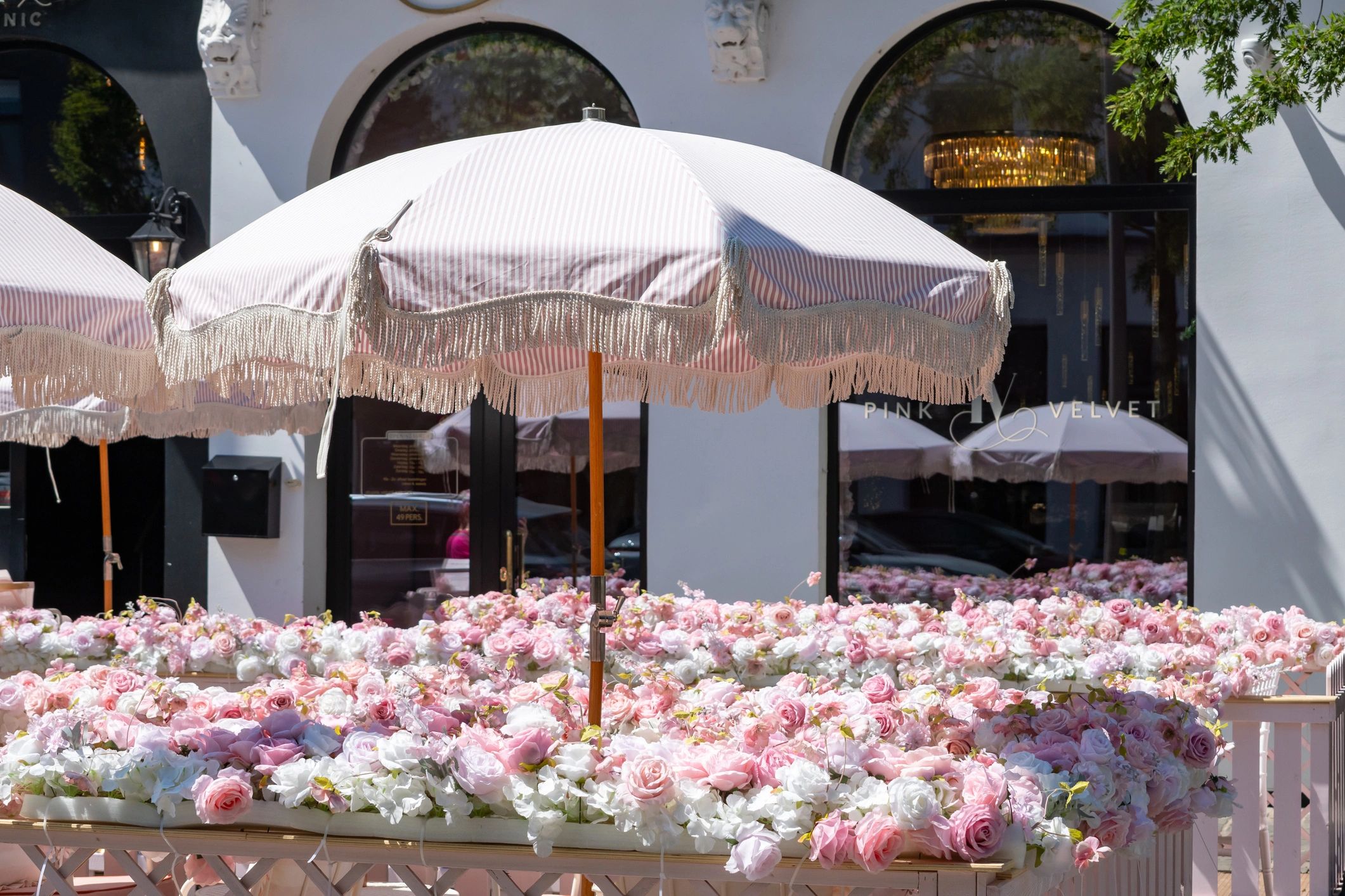 Decorated outdoor event space with floral styling
